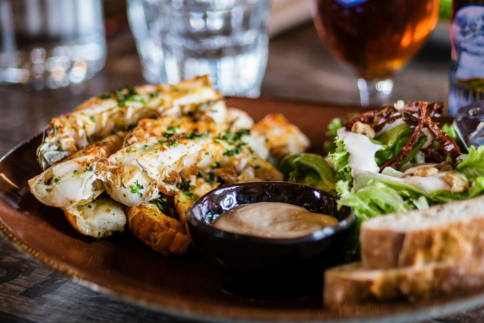 Stock photograph of a shared dining spread; not Ember Table.
